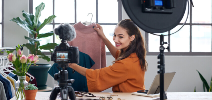 influencer showing merchandise to camera